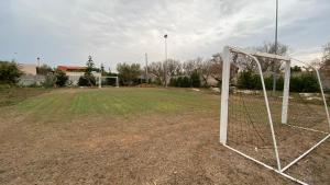 an empty soccer field with a goal at La Chiesura in Galugnano