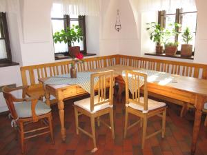 a dining room with a wooden table and chairs at Kovárna in Nová Paka +26 photos