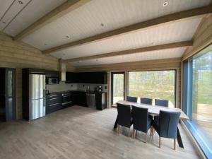 a kitchen and dining room with a table and chairs at Villas Karhunpesä in Saariselka