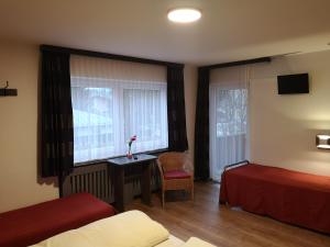 Postel nebo postele na pokoji v ubytování Bed & Breakfast Der Tiroler