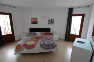 Ein Bett oder Betten in einem Zimmer der Unterkunft Hostal Fornet Altea