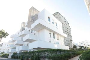 a building with a geometric design on the side of it at Joumaya White & See in Casablanca