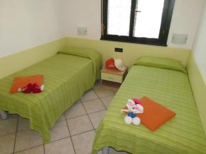 A bed or beds in a room at Villaggio Ducale 012
