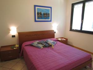 A bed or beds in a room at Villaggio Ducale 012