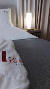 Cama ou camas em um quarto em Casa da Torre - Viseu
