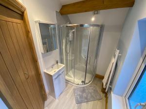 a bathroom with a shower and a sink at Robin Hood Tower in Crich