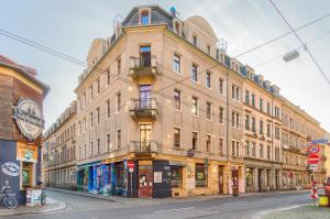 a large building on the side of a street at Hostel Lollis Homestay Dresden in Dresden