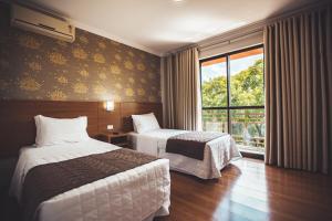Postel nebo postele na pokoji v ubytování Hotel Rafain Centro