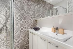 a bathroom with a sink and a shower at Chill Apartments Wola Center in Warsaw +26 photos