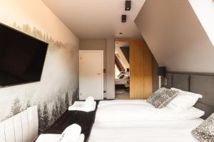 Posteľ alebo postele v izbe v ubytovaní Apartament Giewont House & Spa z Sauną Zakopane