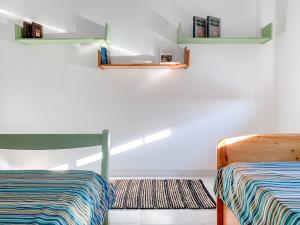 En eller flere senge i et værelse på Apartamento T2 Carvoeiro-Lagoa preços acessíveis