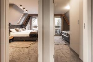Posteľ alebo postele v izbe v ubytovaní Apartament Giewont House & Spa z Sauną Zakopane