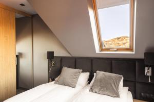 Posteľ alebo postele v izbe v ubytovaní Apartament Giewont House & Spa z Sauną Zakopane