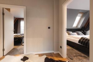 Posteľ alebo postele v izbe v ubytovaní Apartament Giewont House & Spa z Sauną Zakopane
