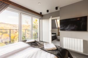 Posteľ alebo postele v izbe v ubytovaní Apartament Giewont House & Spa z Sauną Zakopane