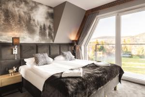 Posteľ alebo postele v izbe v ubytovaní Apartament Giewont House & Spa z Sauną Zakopane