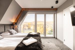 Posteľ alebo postele v izbe v ubytovaní Apartament Giewont House & Spa z Sauną Zakopane