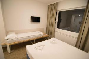 Postel nebo postele na pokoji v ubytování Staza Resort
