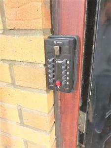 a pay phone is attached to a brick wall at London Zone 2 Lovely 4 bedroom Apartment - 3 Trowbridge Road in London