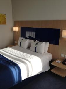 a large white bed in a hotel room at Holiday Inn Express Rotherham - North, an IHG hotel in Rotherham