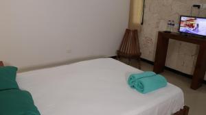 Voodi või voodid majutusasutuse Hotel Itza Coba toas