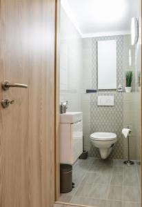 Kúpeľňa v ubytovaní For You Apartmanok