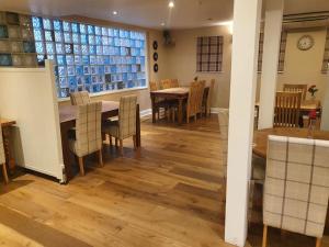 a kitchen and dining room with a table and chairs at The Nags Head in Norwich