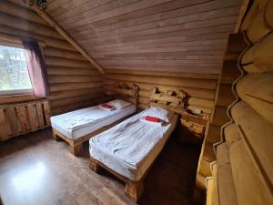 
Кровать или кровати в номере Podmoskovnyi Domik
