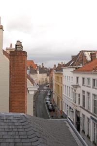 a view of a city street with buildings at Apartments Ridderspoor in Bruges