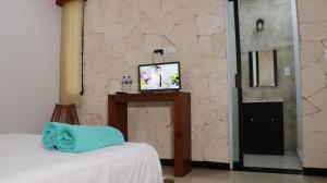 Voodi või voodid majutusasutuse Hotel Itza Coba toas