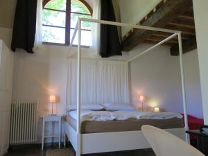 A bed or beds in a room at Agriturismo Apparita