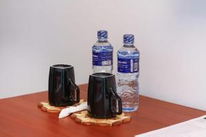a table with two bottles of water at The Domain in Piliyandala