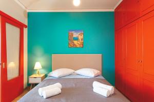 Posteľ alebo postele v izbe v ubytovaní CHAMBRE ORANGE