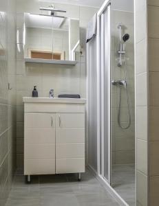 Ванна кімната в For You Apartmanok