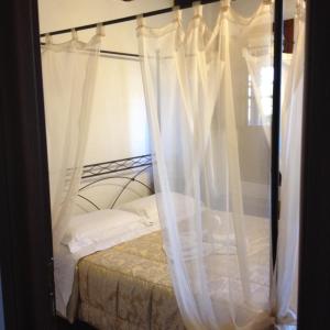 Postel nebo postele na pokoji v ubytování B&B Il Casale di Nanni