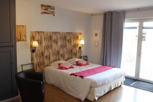 Postel nebo postele na pokoji v ubytování Hotel La Peyrade