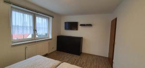TV a/nebo společenská místnost v ubytování Apartment Marx