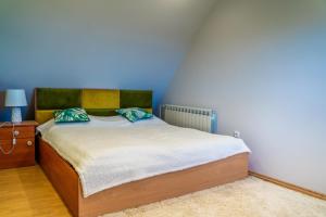 Ένα ή περισσότερα κρεβάτια σε δωμάτιο στο Willa Sulimówka - Noclegi Zakliczyn dom basen bania sauna SPA