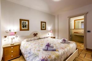 a bedroom with a large bed with two pillows on it at Valle Maura in Canazei