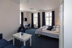 Postel nebo postele na pokoji v ubytování Skagen Hotel