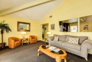 a living room with a couch and a coffee table at Villa Tanisha - Luxury with pool in Palm Springs +11 photos