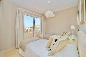 a bedroom with two beds and a large window at 3 Bed House - Sleeps 6 - Pool - Garden - Parking in Atamaría