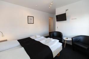 Säng eller sängar i ett rum på Foldens Hotel Annex