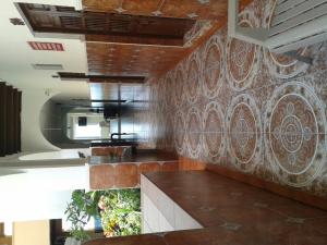a room with a wall with a stone wall at Hotel Real del Mar in Veracruz