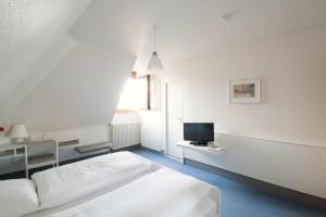 Säng eller sängar i ett rum på Hotel Krone Straßdorf
