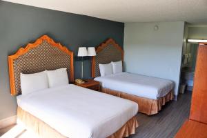 Postel nebo postele na pokoji v ubytování Hotel Elev8