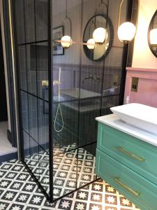 a bathroom with a shower and a sink at Boutique home near Chichester centre in Chichester +23 photos