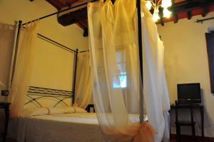 Postel nebo postele na pokoji v ubytování B&B Il Casale di Nanni