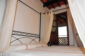 Postel nebo postele na pokoji v ubytování B&B Il Casale di Nanni + 37 fotografií