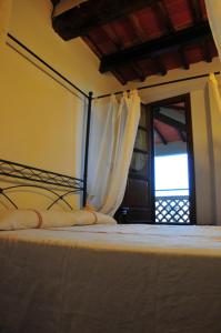 Postel nebo postele na pokoji v ubytování B&B Il Casale di Nanni
